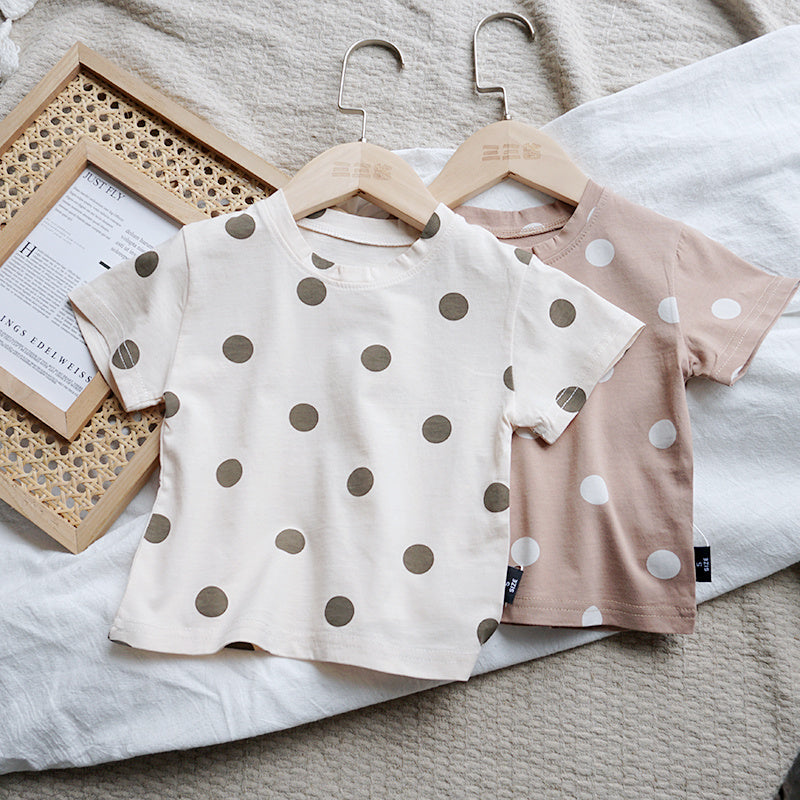 Baby wearing a cotton dot t-shirt with short sleeves for summer