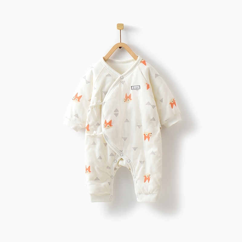 Baby in a thick cotton romper, ideal for fall and winter